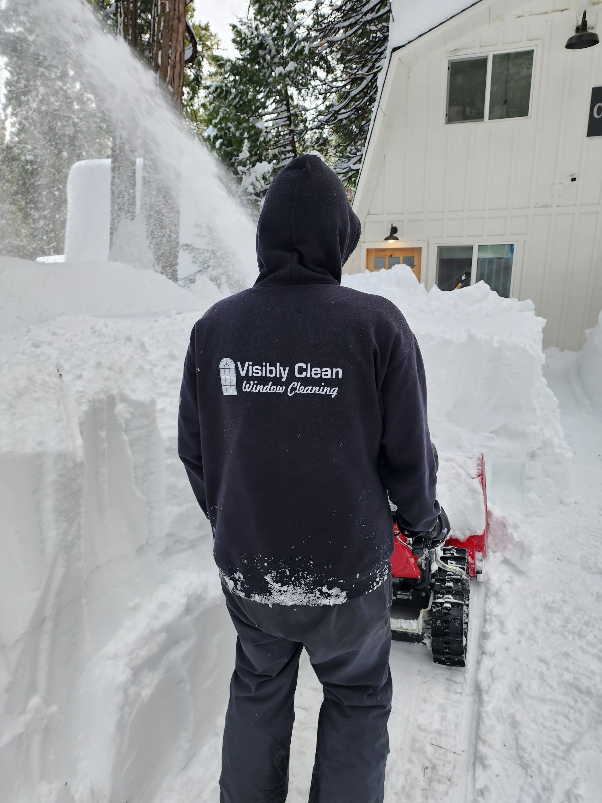 A wooden chair with a blue cushion on a white background.