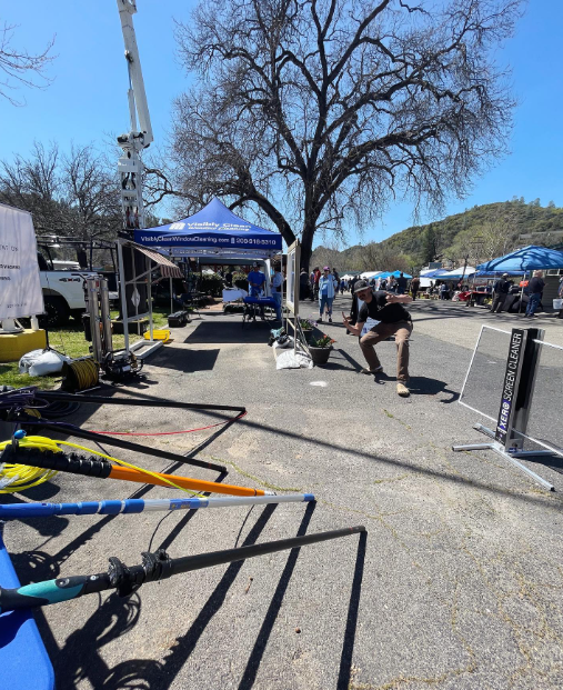 A blurry picture of a man kneeling down in a parking lot
