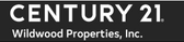 A black and white sign for century 21 wildwood properties inc.