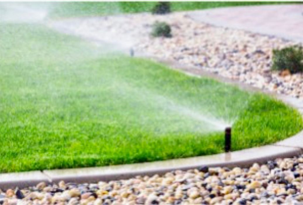 Water Sprinkler on Walkway — Green Taskk Landscaping — Mid-West, FL