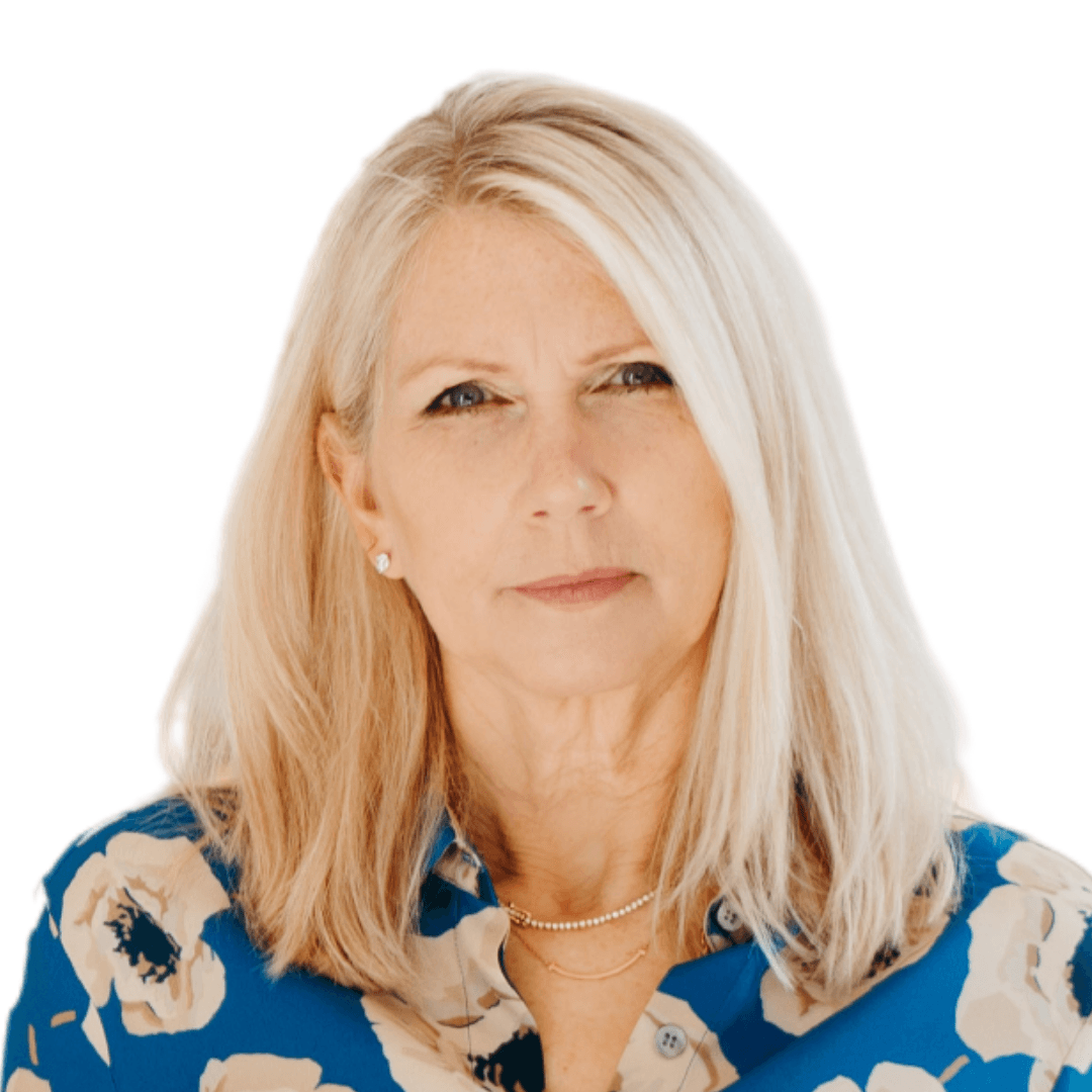 A woman with blonde hair is wearing a blue floral shirt.