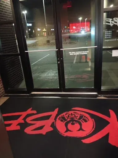 Black doormat with red 