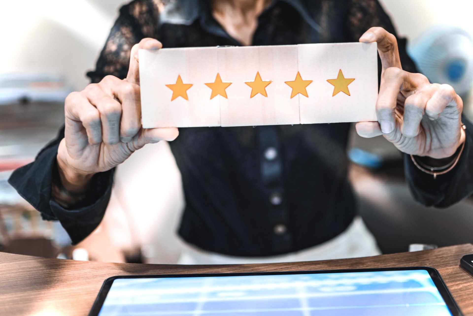 Woman Holding Five Gold Star — San Diego, CA — Dave Ray Coaching & Consulting