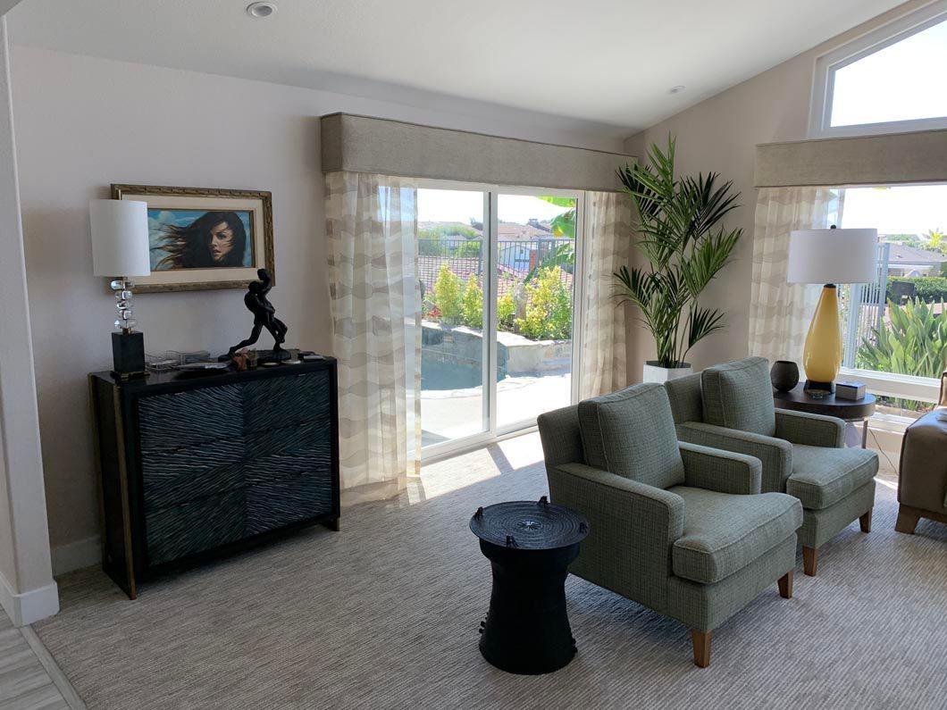 A living room filled with furniture and a sliding glass door