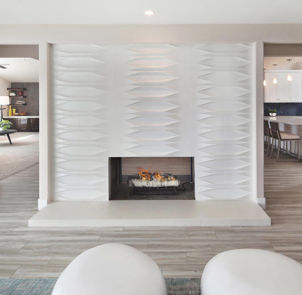 There is a fireplace in the middle of the room.