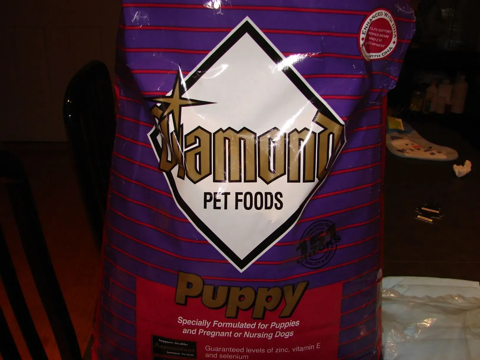 A bag of diamond pet foods puppy sits on a table