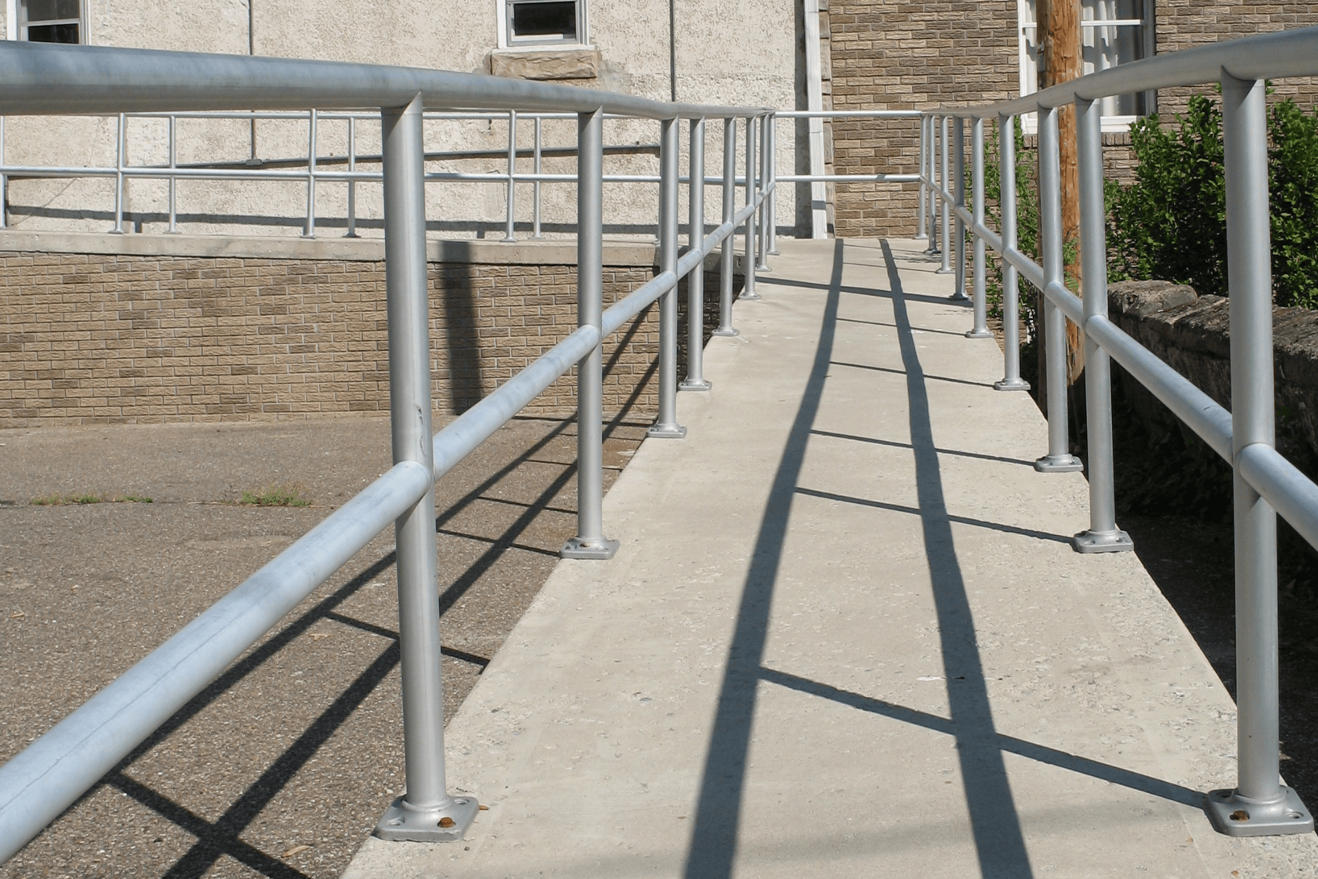 handicap concrete ramp with railings