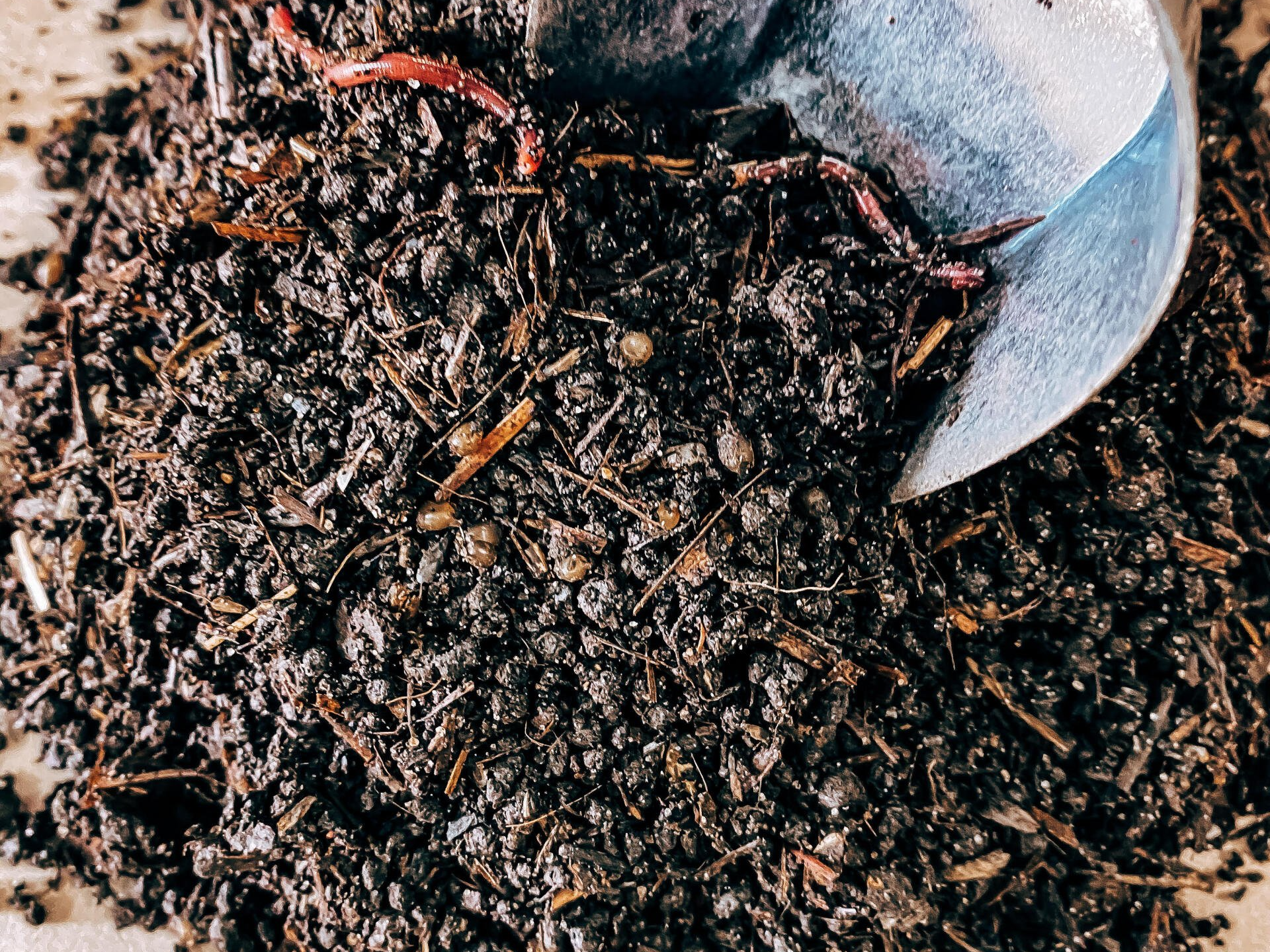 a shovel is digging into a pile of dirt