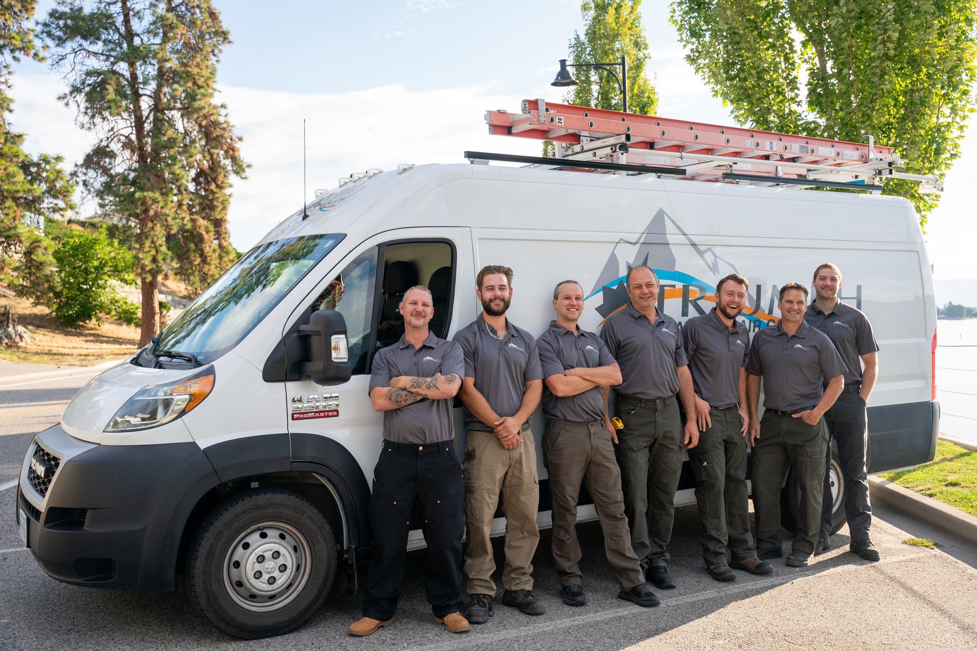 A row of vans parked in front of a building.