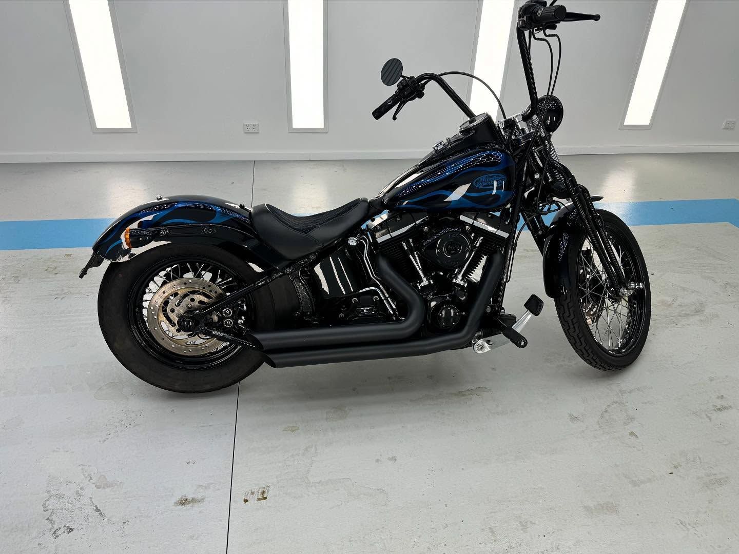 A Blue Harley Davidson Motorcycle is Parked in a Garage — Bathurst Detailing Studio in Forbes, NSW