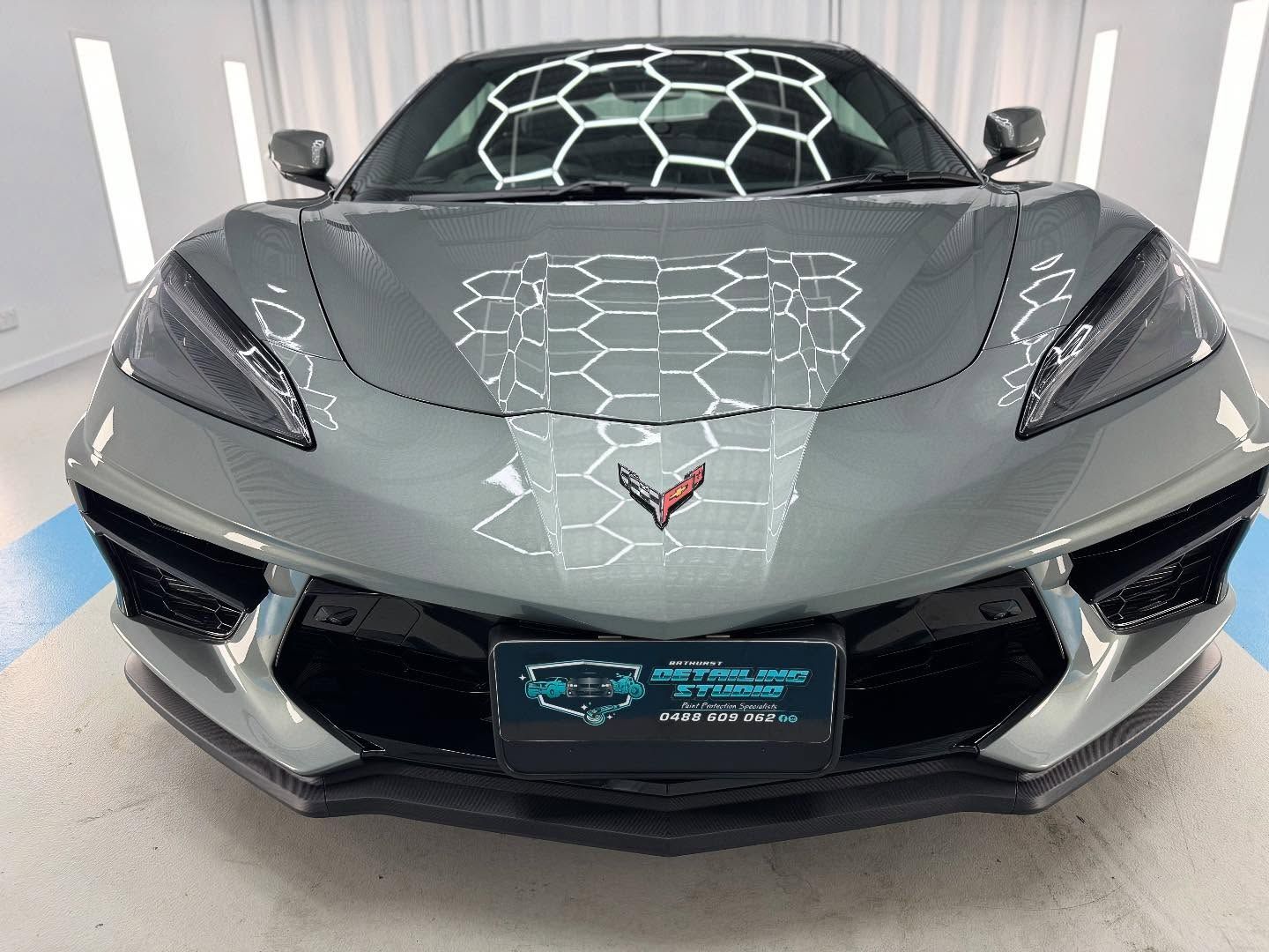A Gray Corvette Sports Car is Parked in a Garage — Bathurst Detailing Studio in Parkes, NSW