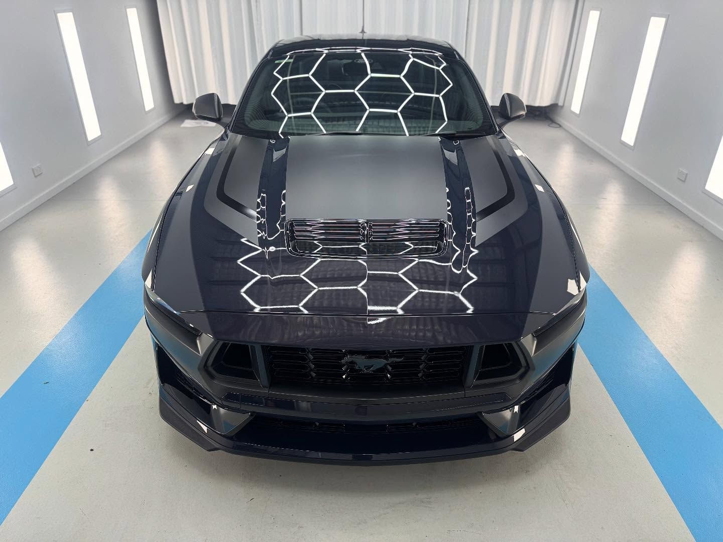 A Black Ford Mustang is Parked in a Garage — Bathurst Detailing Studio in Mudgee, NSW