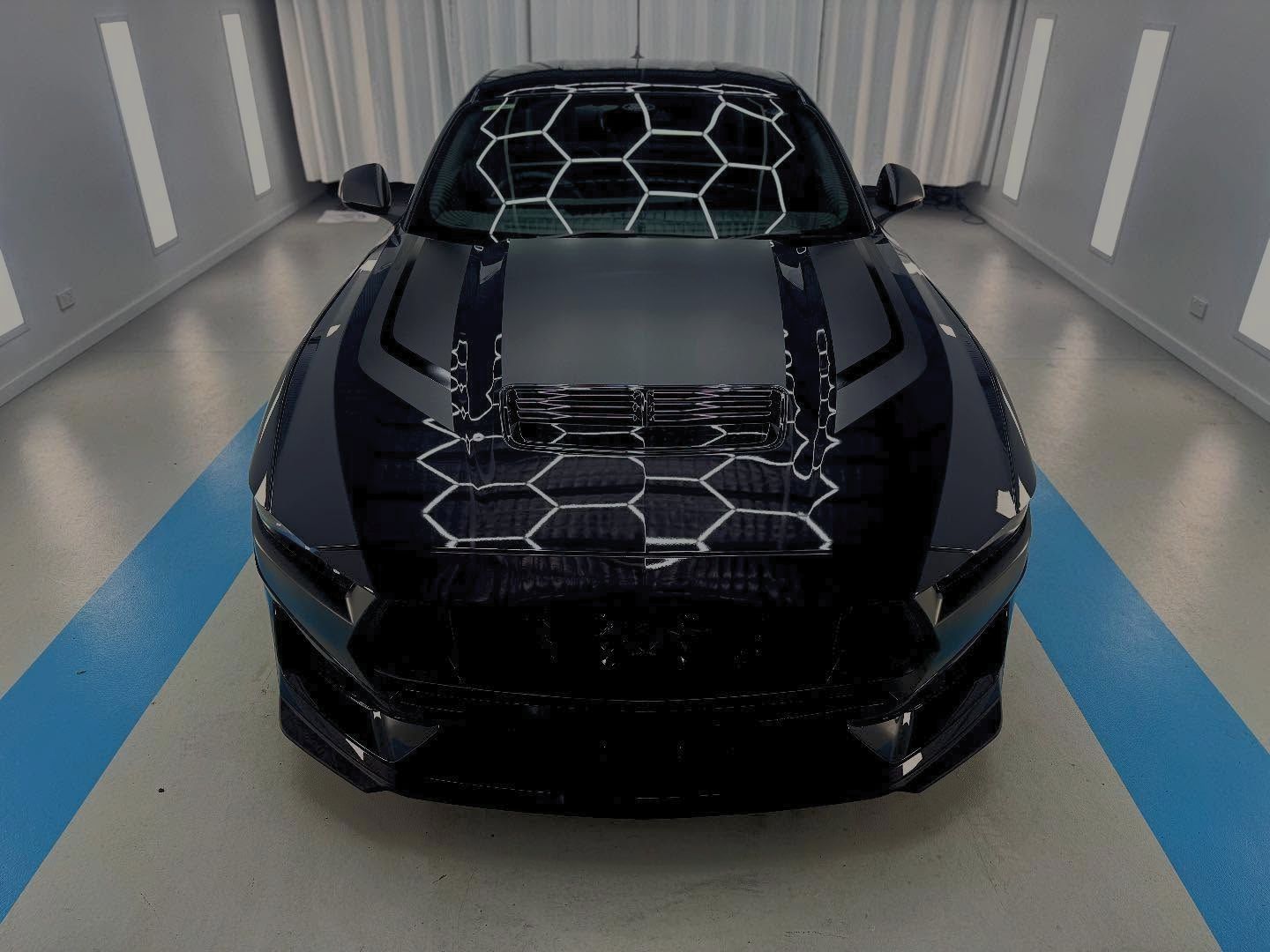 A Black Ford Mustang is Parked in a Garage — Bathurst Detailing Studio in Bathurst, NSW