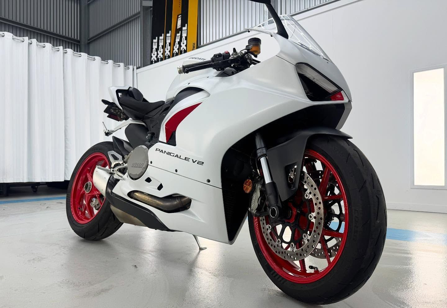 A Close Up of White Ducati Parked in Garage — Bathurst Detailing Studio in Orange, NSW