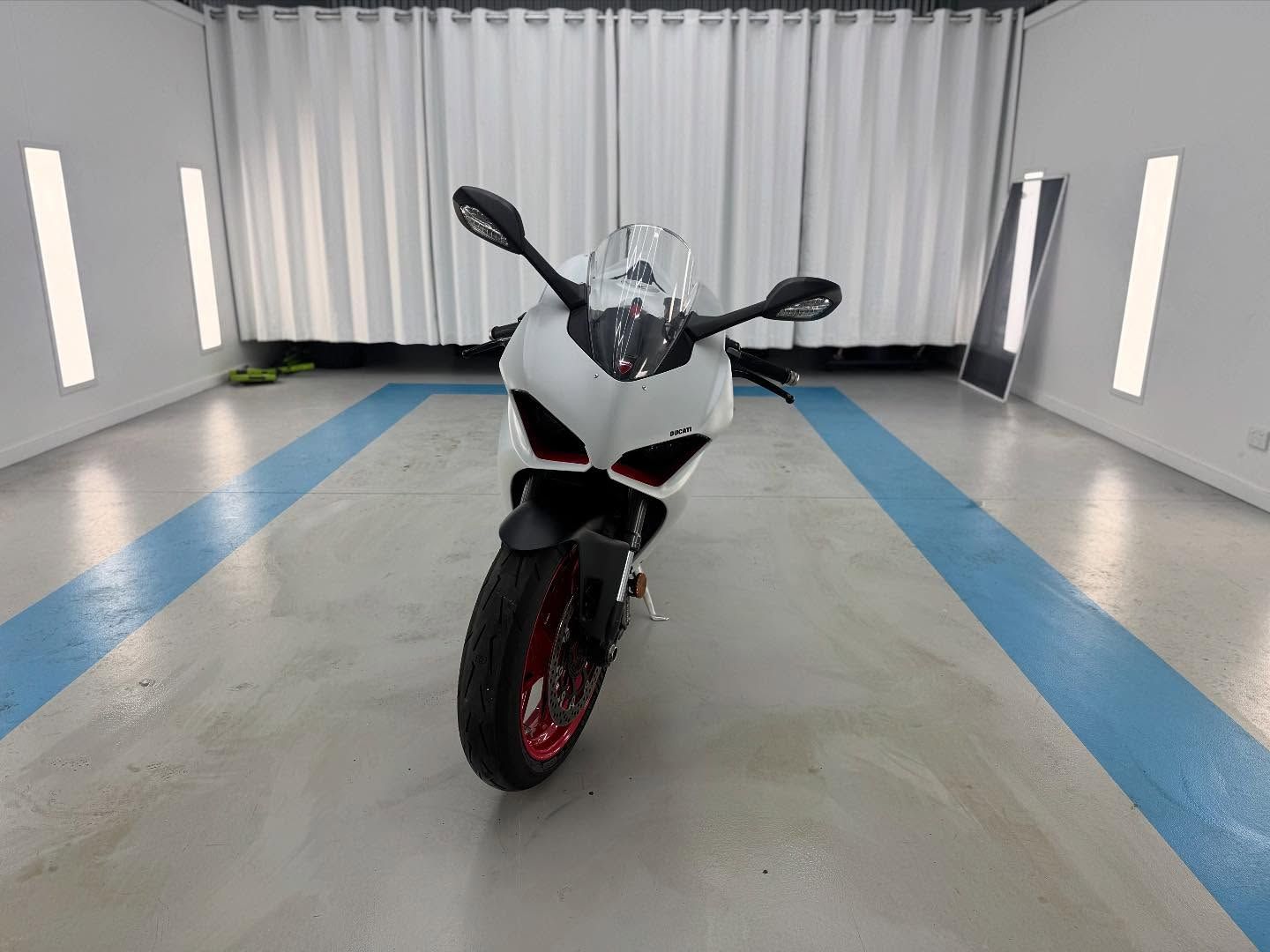 A Front on Shot of White Ducati Parked in Garage — Bathurst Detailing Studio in Orange, NSW