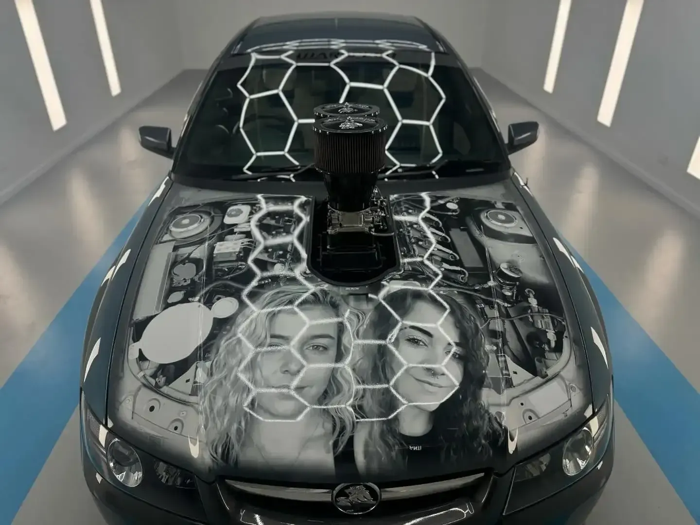 A Black Car With a Honeycomb Design on the Hood — Bathurst Detailing Studio in Bathurst, NSW