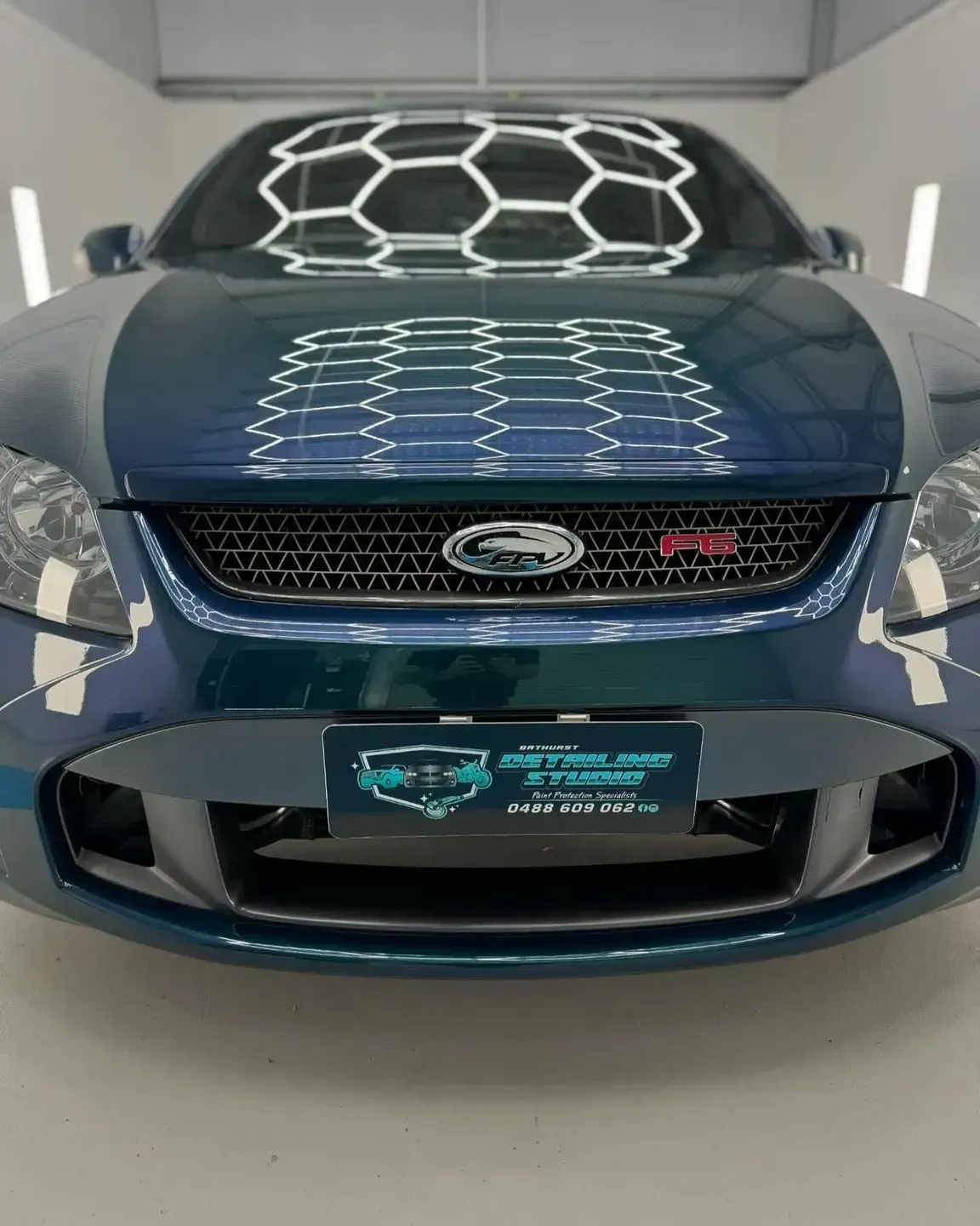 A Blue Ford Car is Parked in a Garage — Bathurst Detailing Studio in Bathurst, NSW