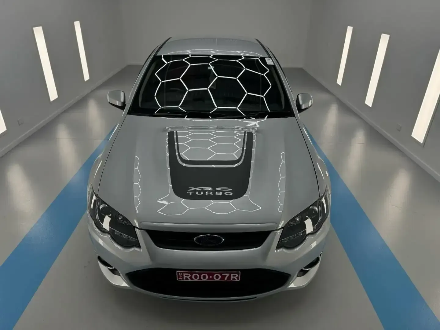 A Silver Car In A Showroom — Bathurst Detailing Studio in Bathurst, NSW