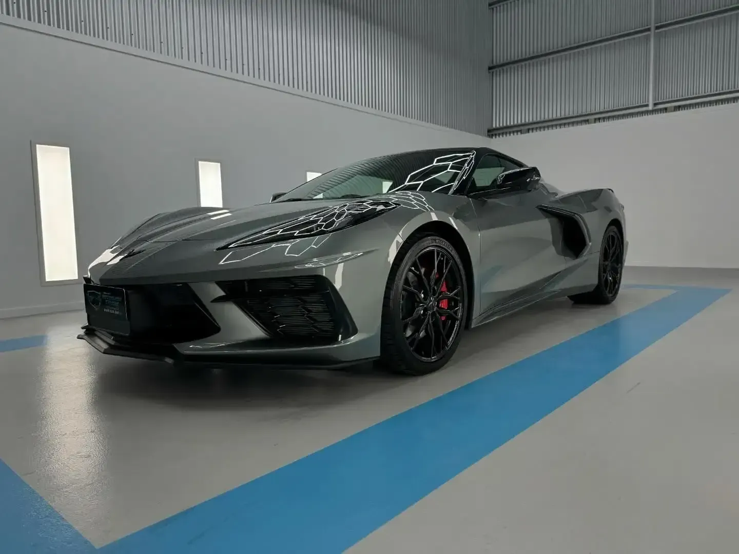 A Gray Sports Car is Parked in a Garage — Bathurst Detailing Studio in Bathurst, NSW