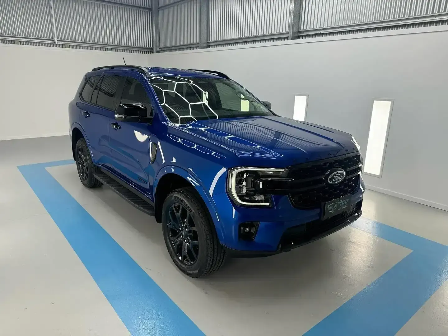 A Blue Ford Ranger is Parked in a Showroom — Bathurst Detailing Studio in Bathurst, NSW