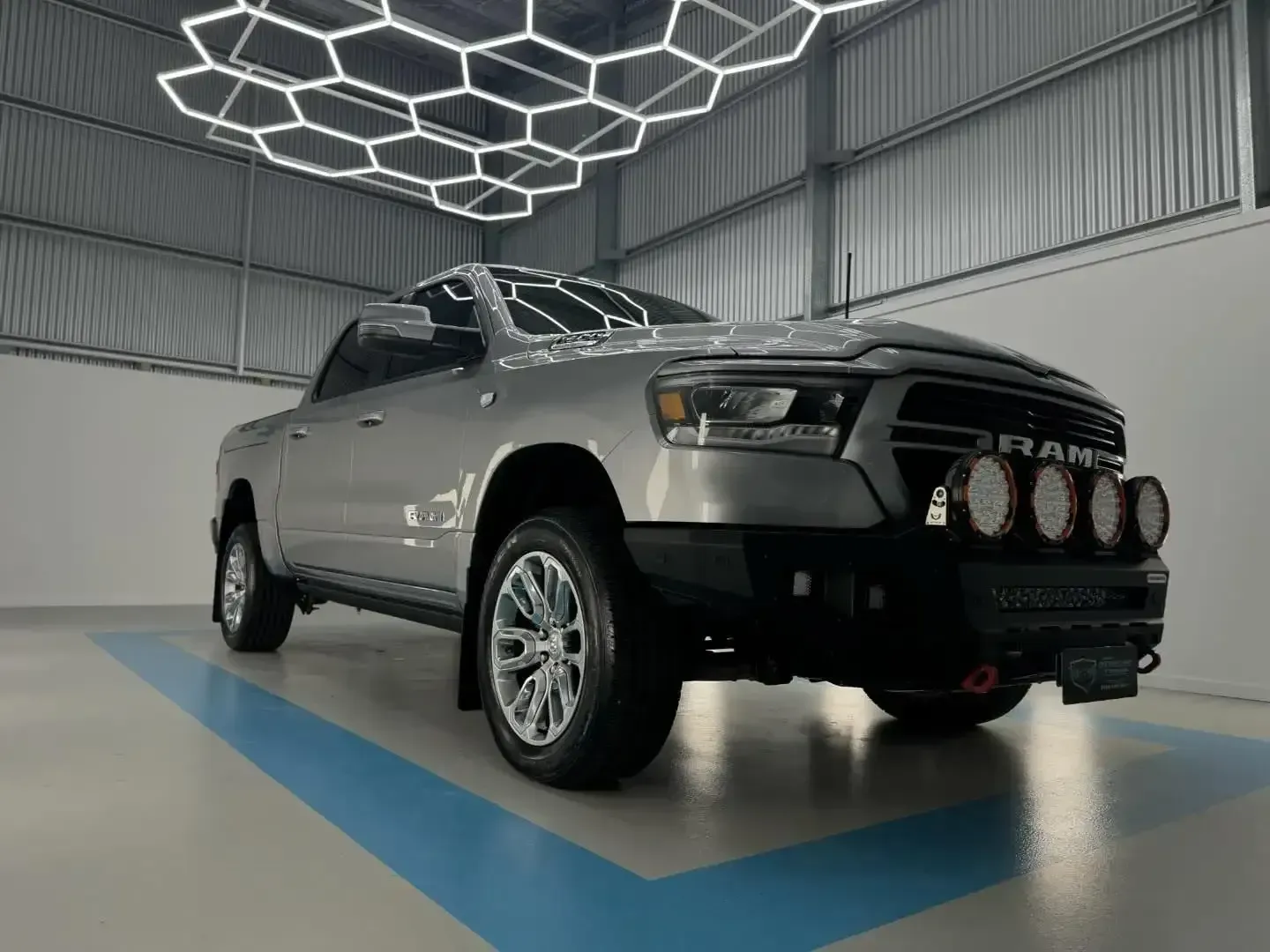 A Silver Ram Truck is Parked in a Showroom — Bathurst Detailing Studio in Bathurst, NSW