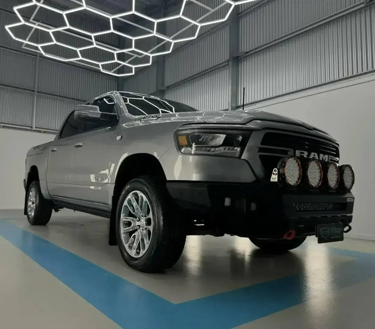 A Silver Ram Truck is Parked in a Showroom  — Bathurst Detailing Studio in Bathurst, NSW