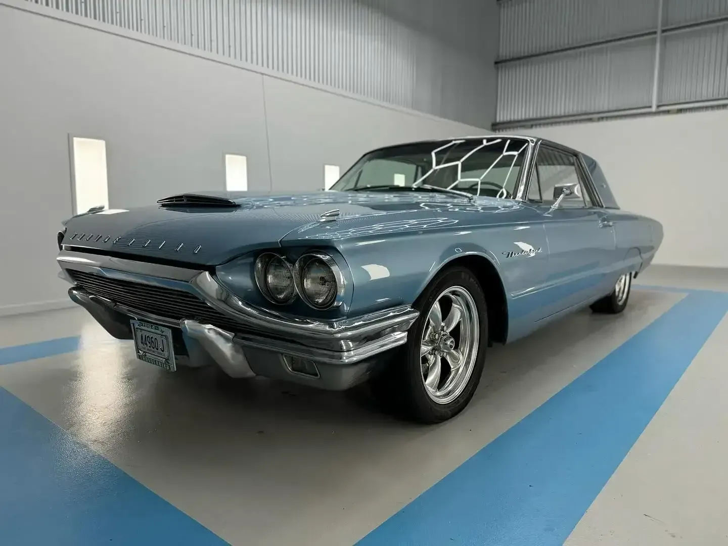 A Blue Thunderbird is Parked in a Garage — Bathurst Detailing Studio in Bathurst, NSW