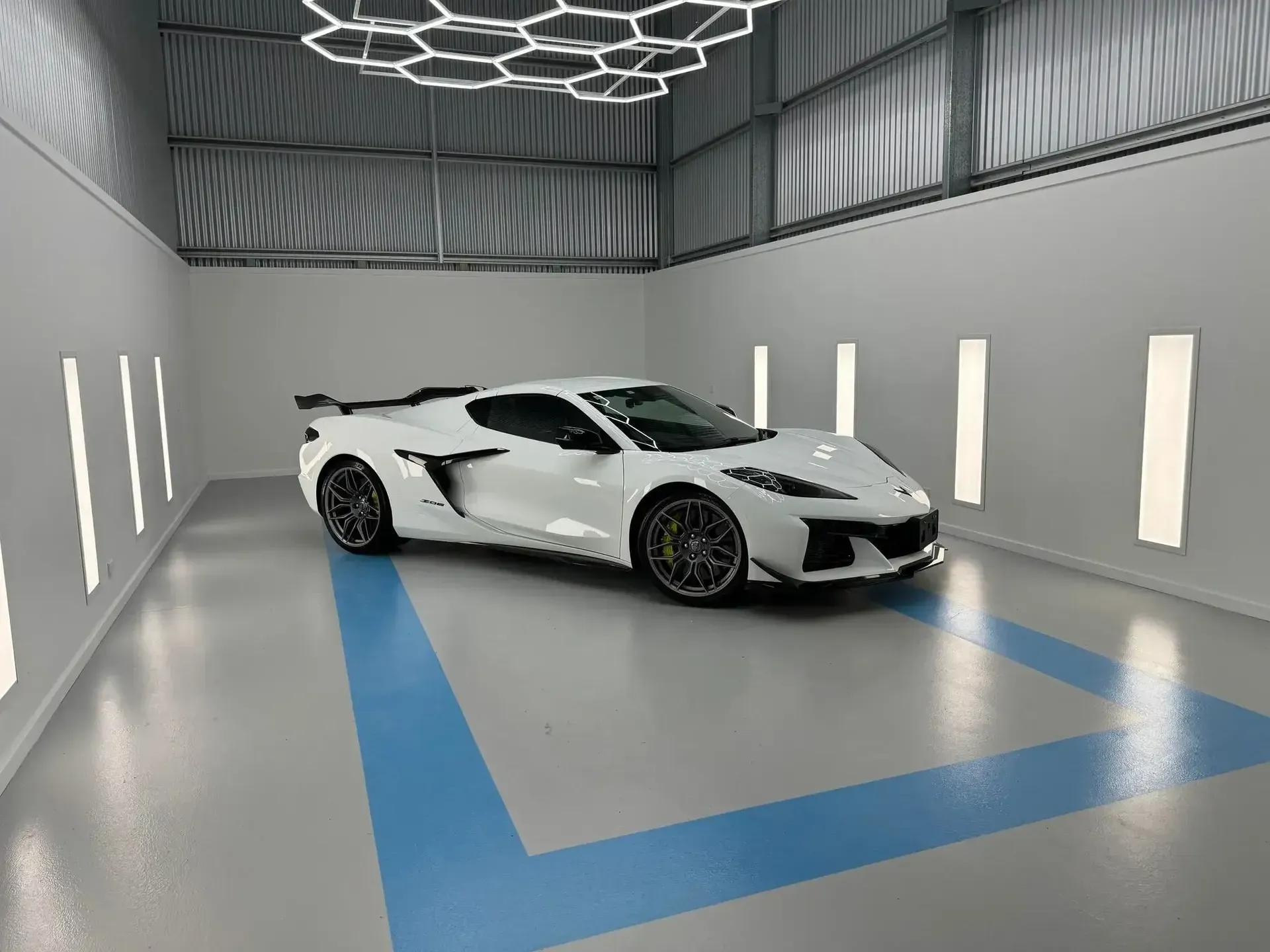 A White Sports Car is Parked in a Garage — Bathurst Detailing Studio in Bathurst, NSW