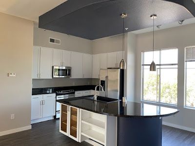 There is a large island in the middle of the kitchen.