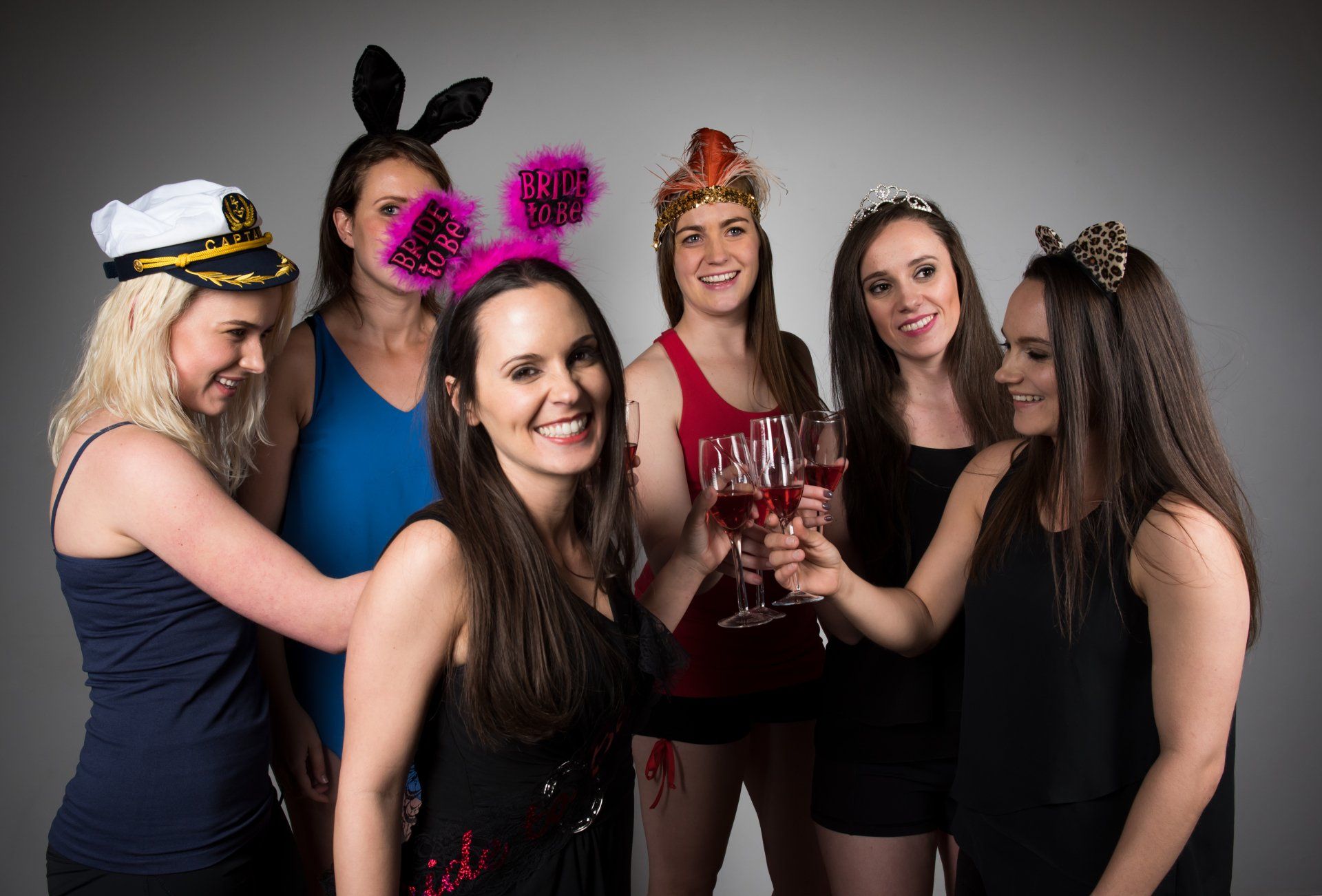 girls at bachelorette party toasting drinks