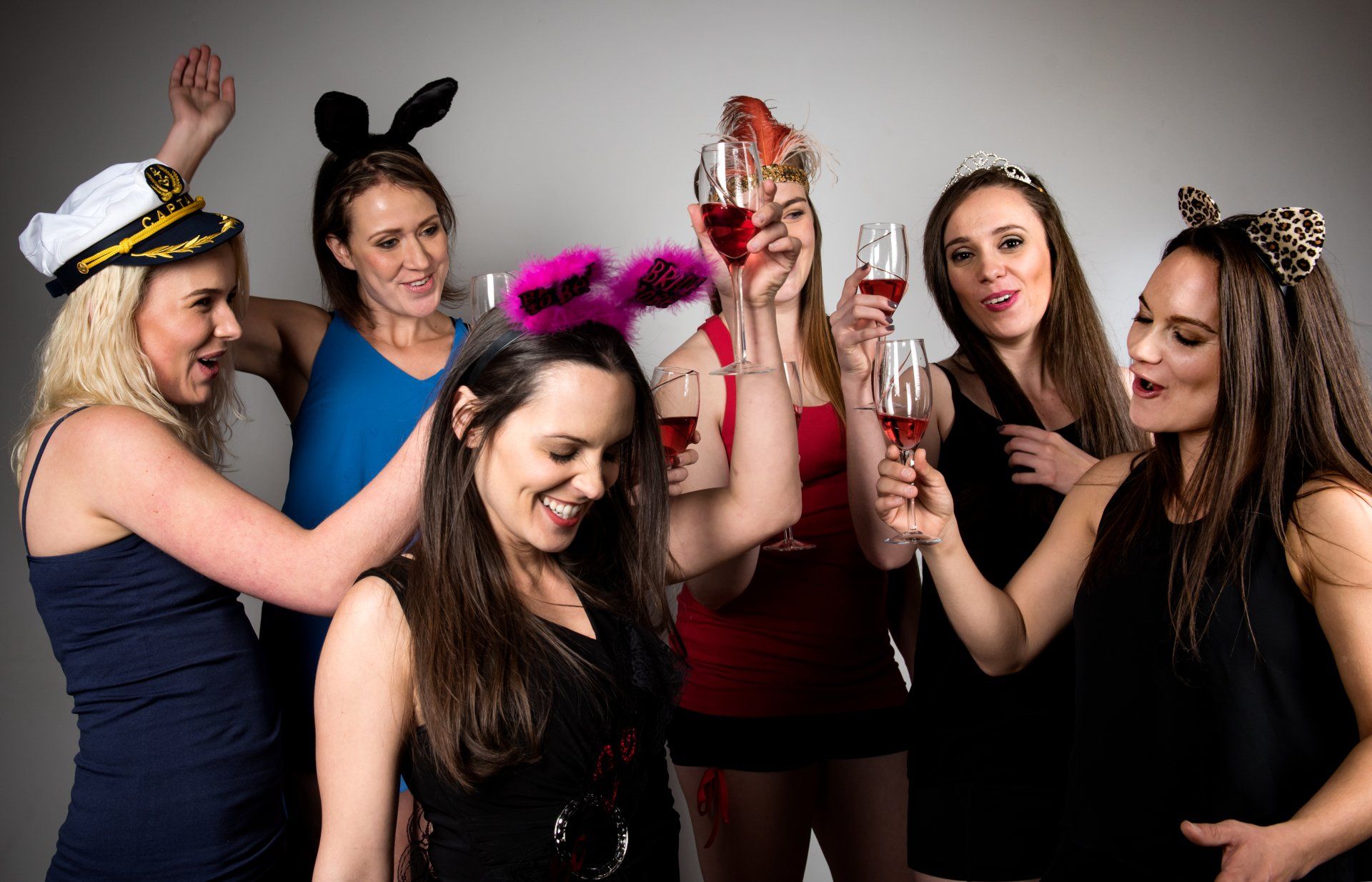 girls at bachelorette party posing for camera