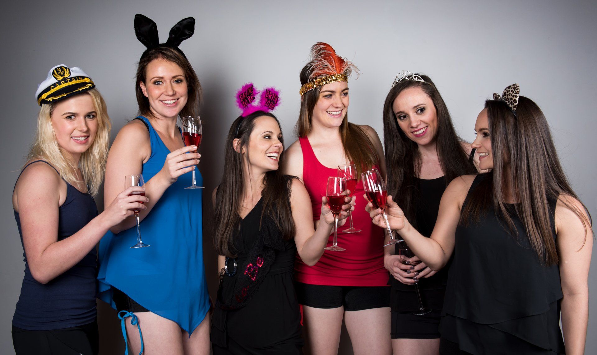 girls at bachelorette party toasting drinks