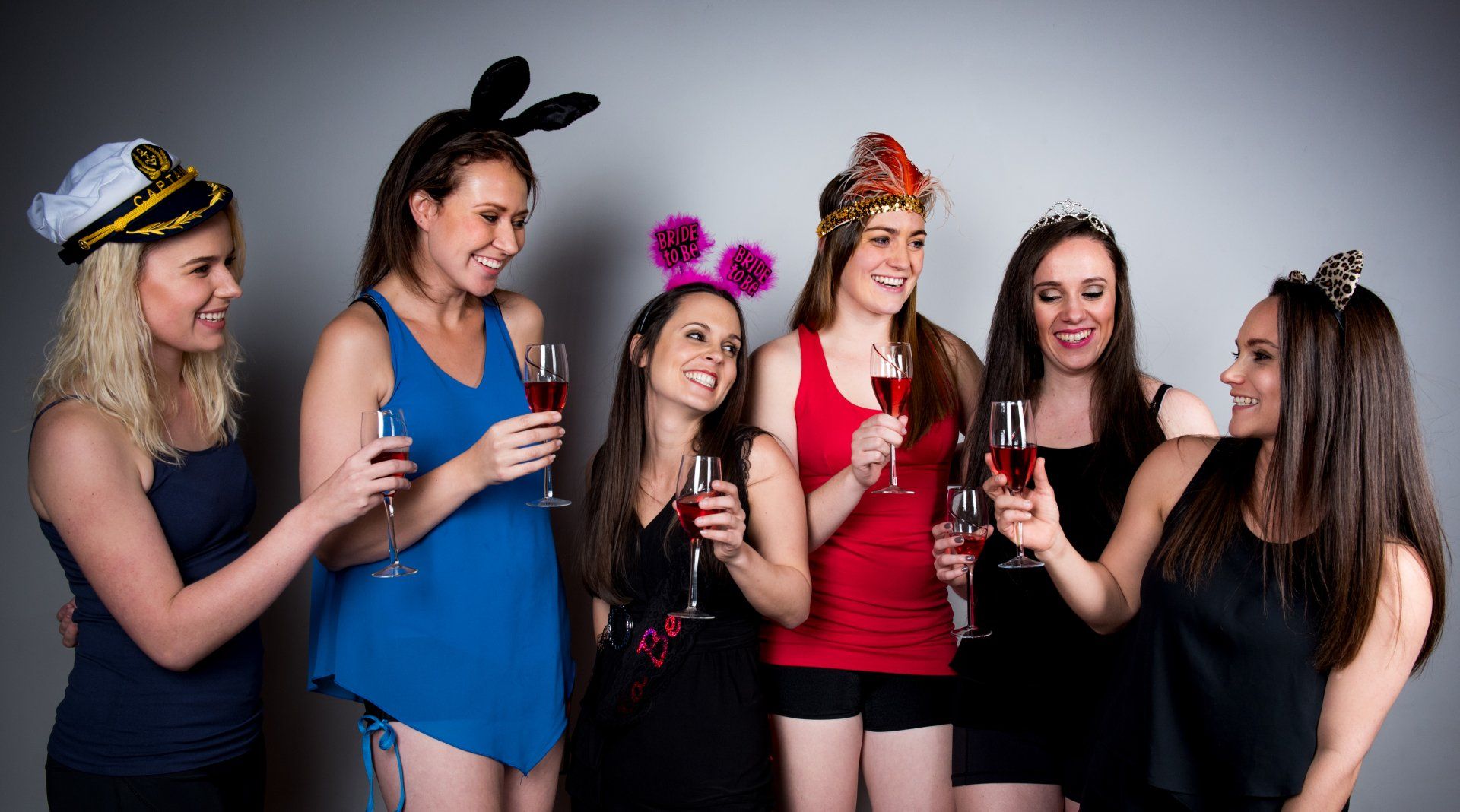 girls at bachelorette party toasting drinks