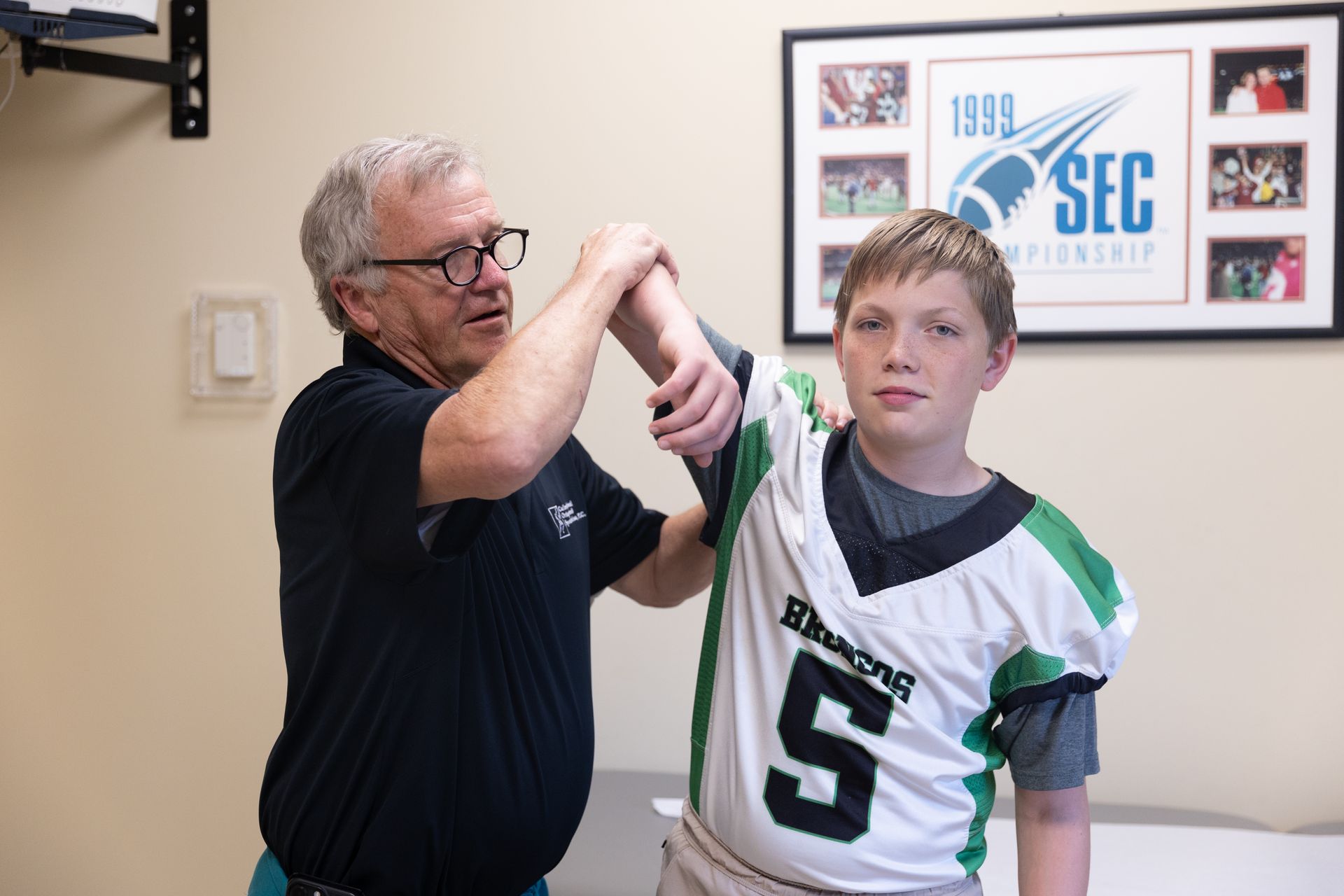 A model of a hand and feet is sitting on a table.