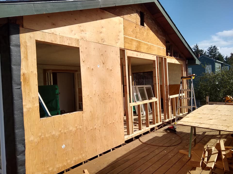 A house is being built with a lot of plywood.