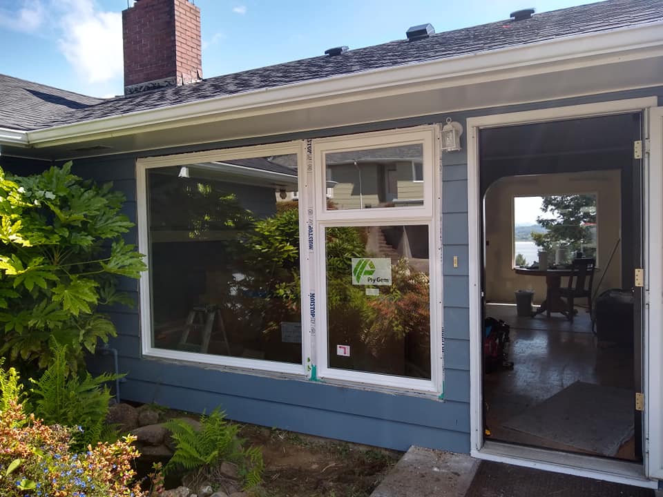 A house with a lot of windows and a sign that says yes