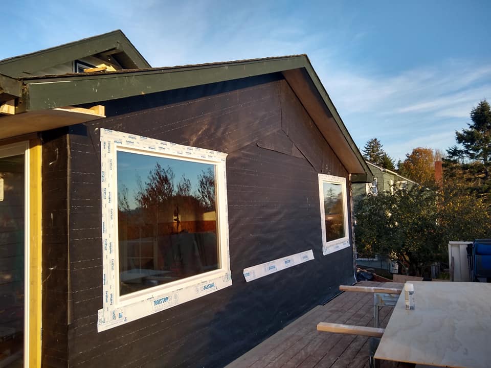 A house with a lot of windows on the side of it