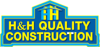 A blue sign that says h & h quality construction