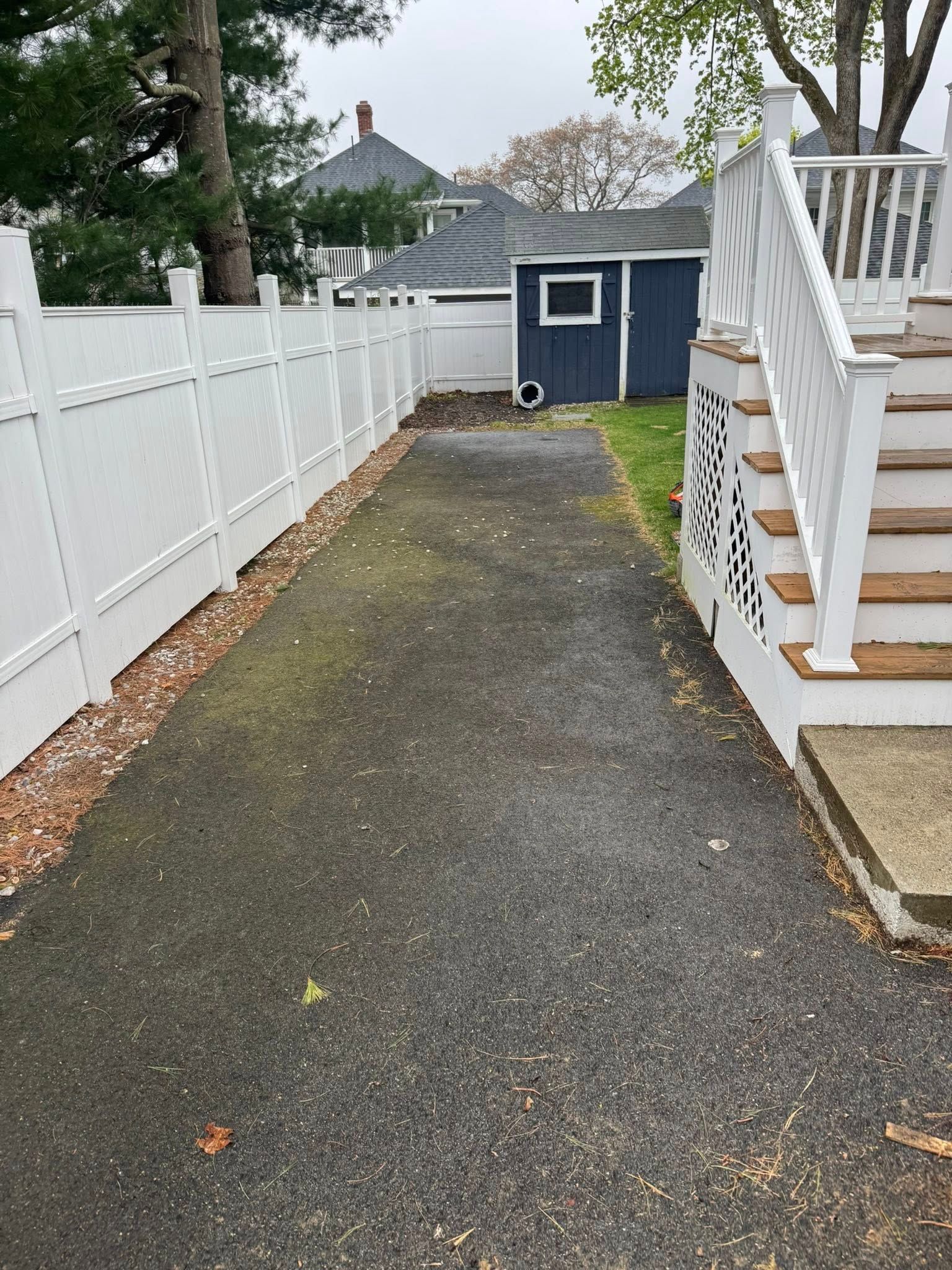Dilapidated, dirty blue-tiled circular pool and steps. 
