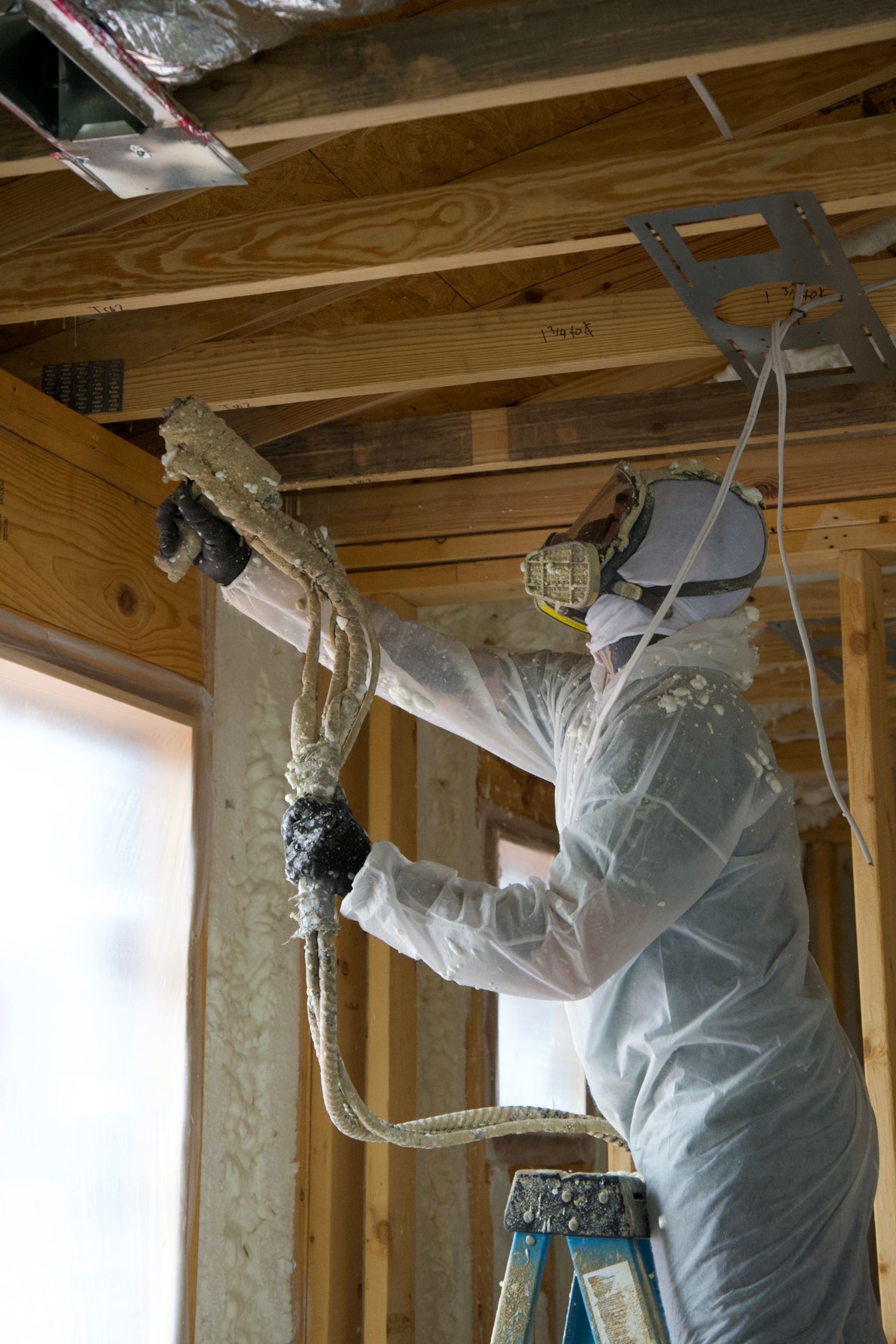 Spray foam insulation crew installing foam in Chattanooga attic