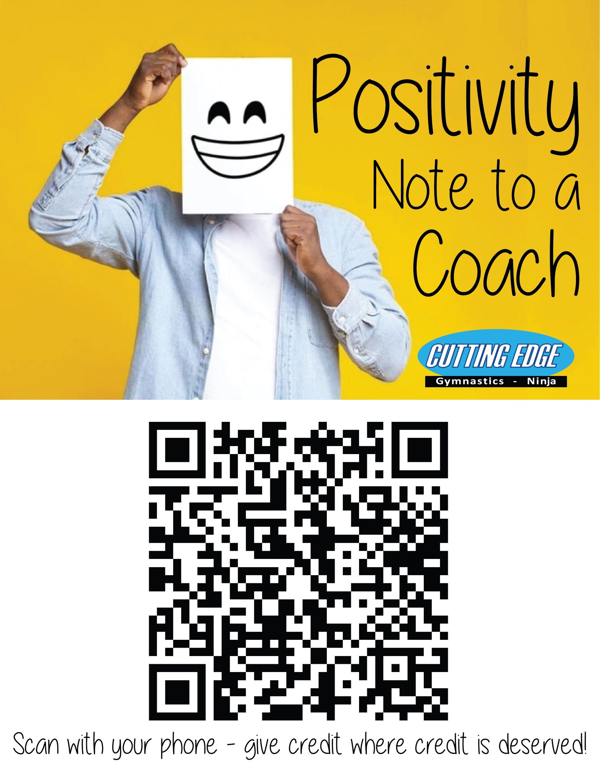 A man is holding a sign with a smiley face on it in front of his face.