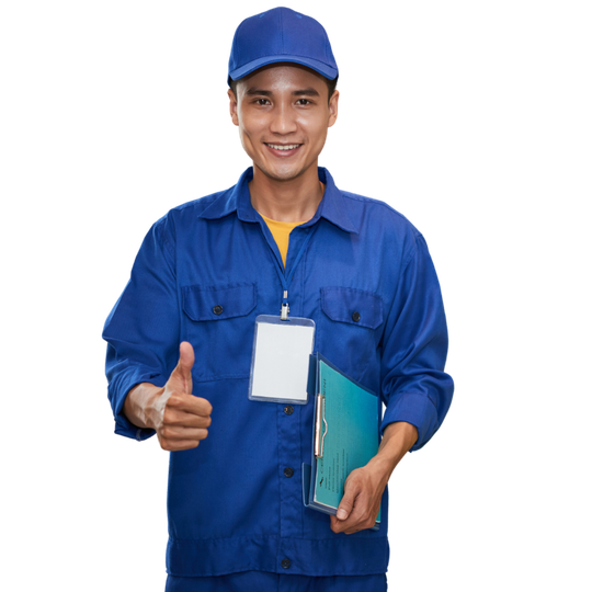 A man in red overalls and a red hat is using a tablet computer.