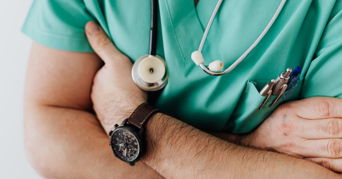 Close up crop of a doctor with arms crossed. 