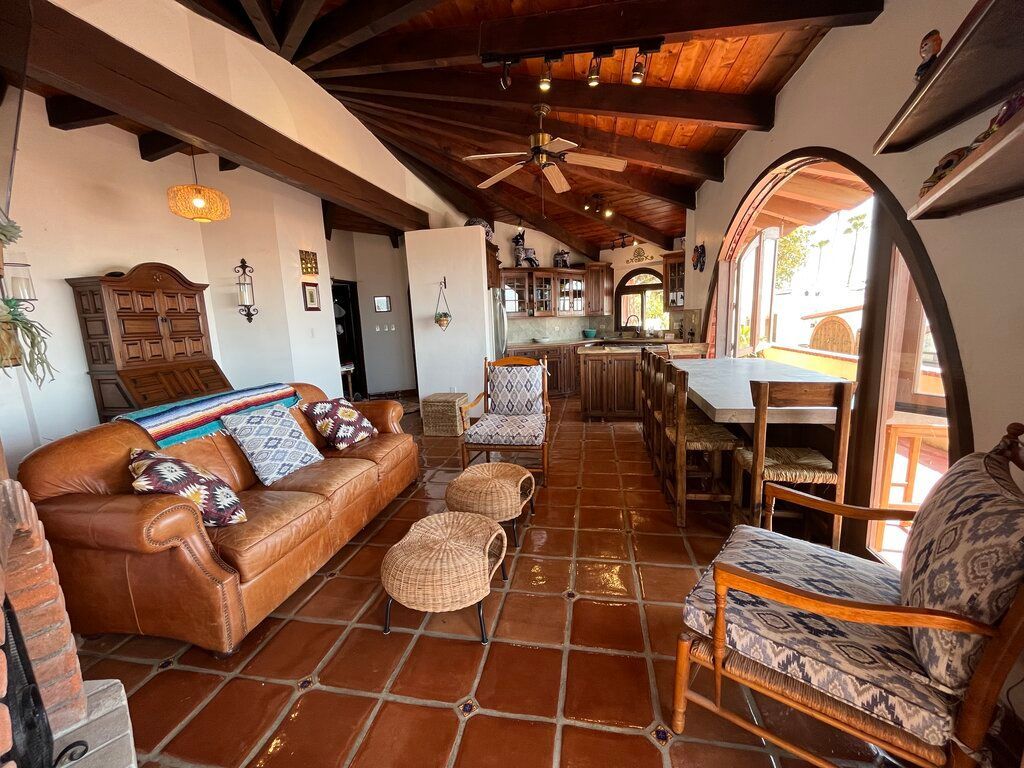 Living room at Casa El Nido with indoor/outdoor dining table