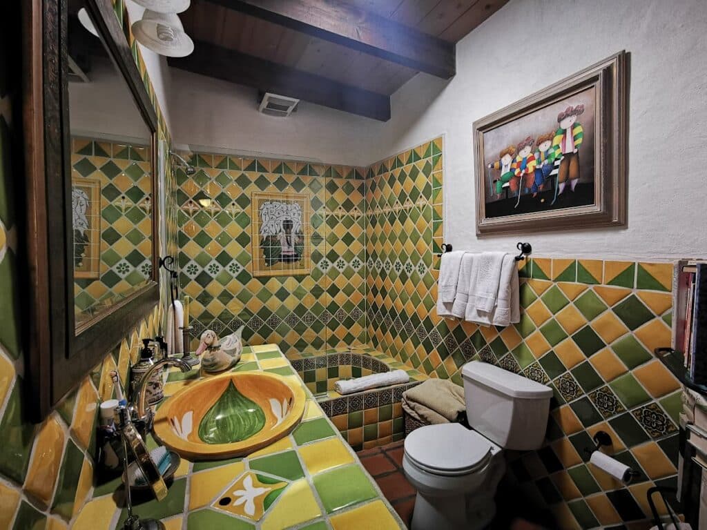 Bathroom full of colorful green and yellow tile at Las Gaviotas in Baja California