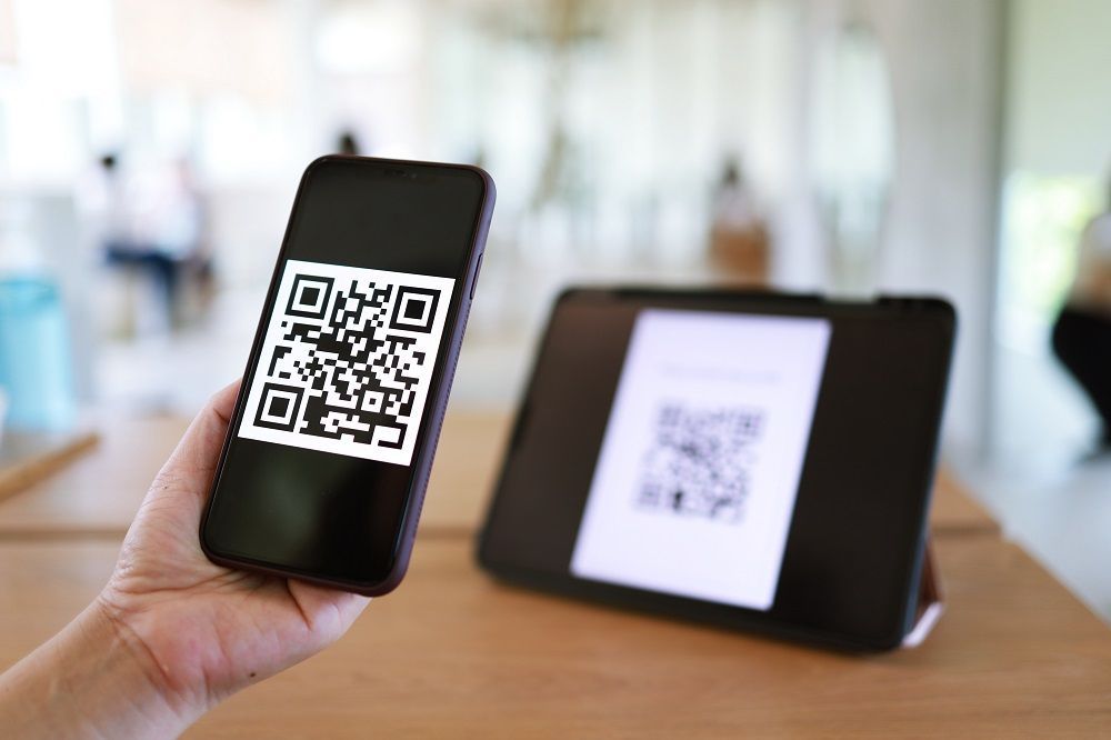 QR code on an tablet being scanned by a mobile phone