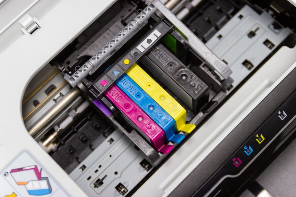 Close up of a set of printer ink cartridges loaded into a printer