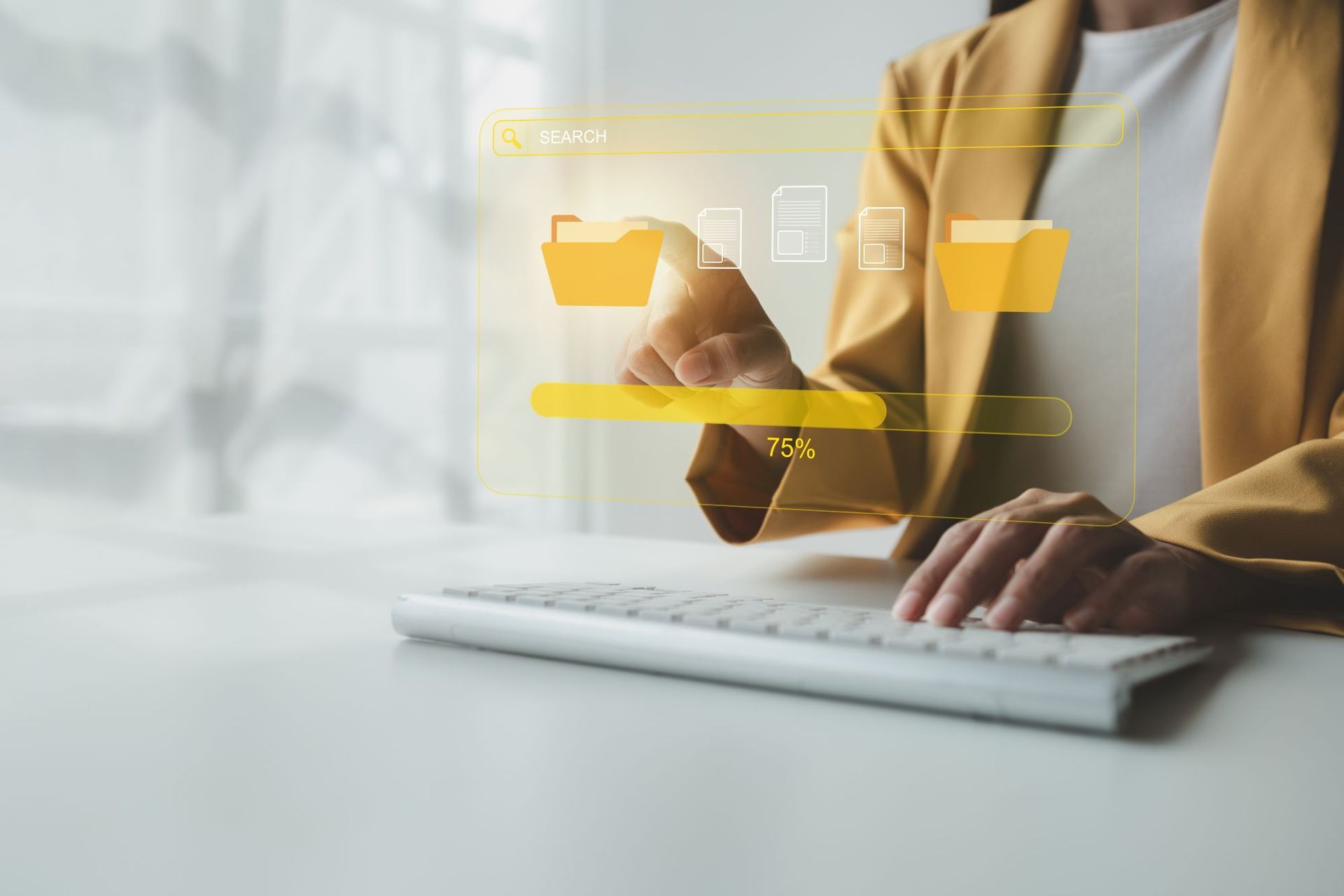 Woman witting at a desk on a laptop access folder company data