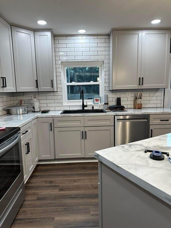 A kitchen with wooden cabinets and stainless steel appliances