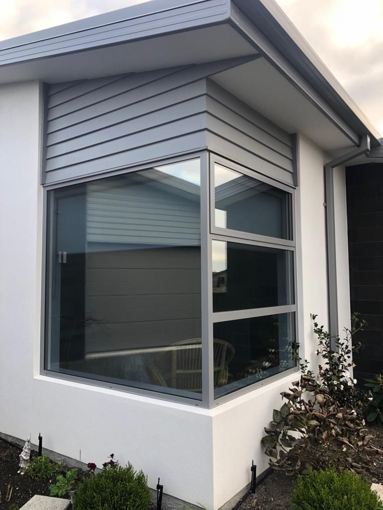 A white house with a large window on the side - Christchurch, NZ - Tint A Window
